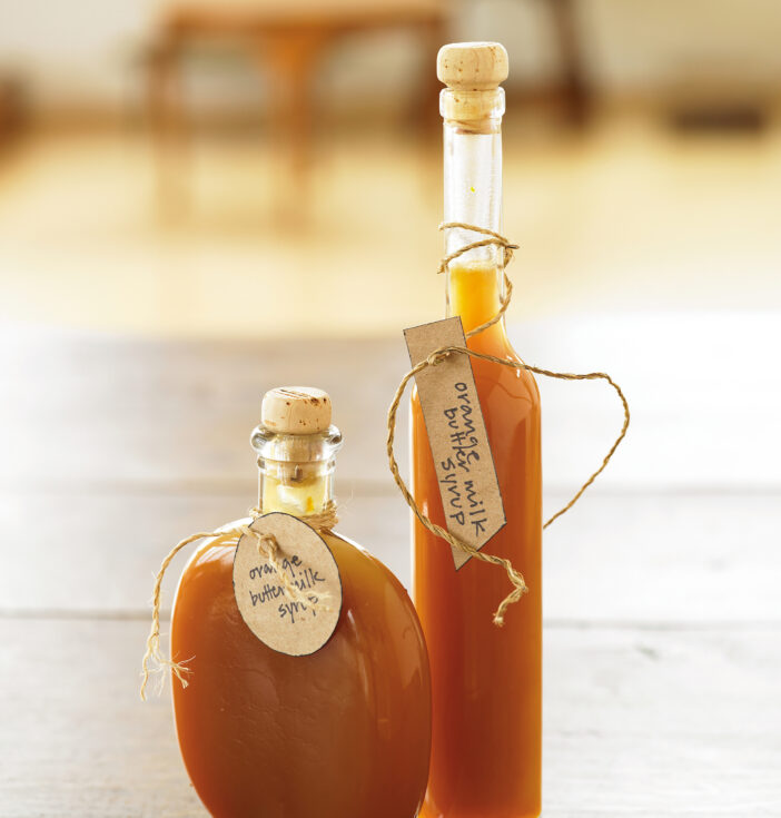 Two decorative jars of syrup